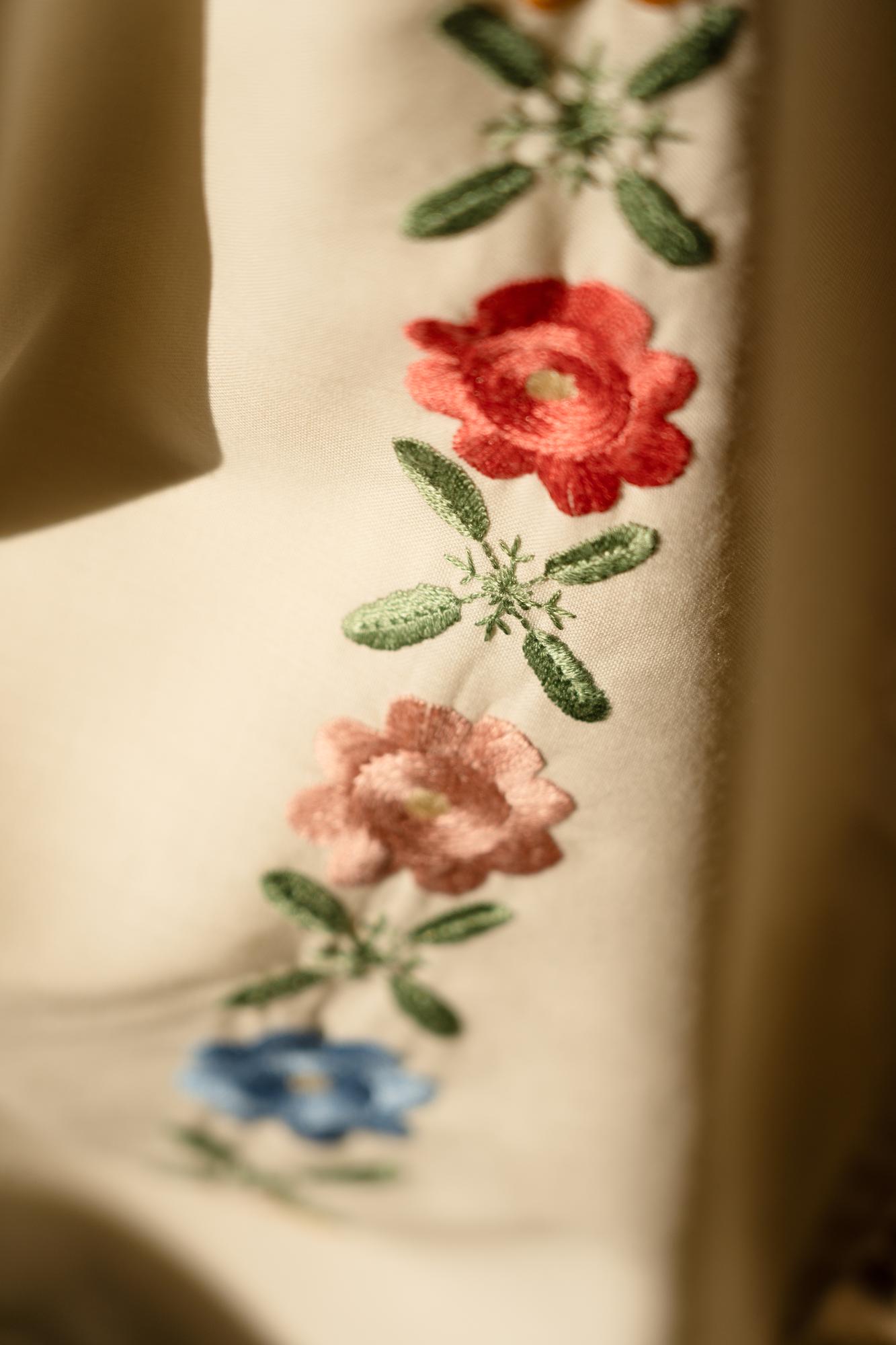 Hand-stitched floral embroidery on linen