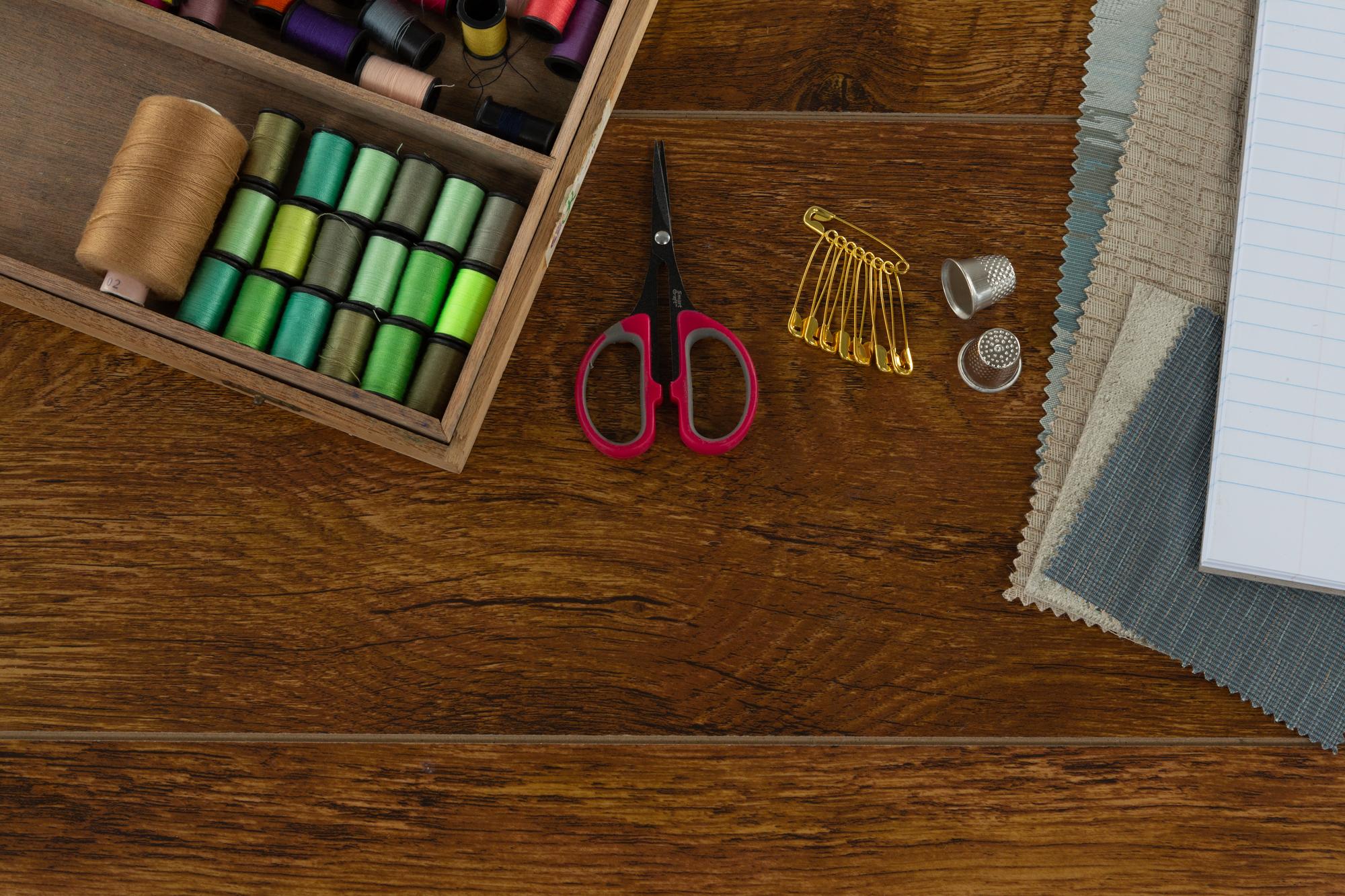 Workspace with embroidered samples and tools